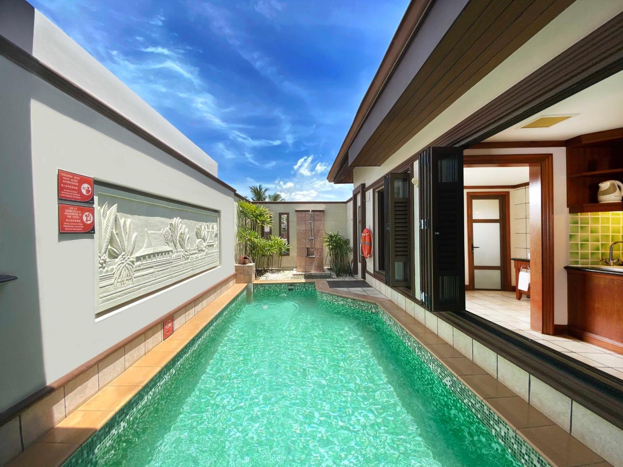 Grand Lexis Port Dickson Hotel Exterior photo A pool villa at the resort